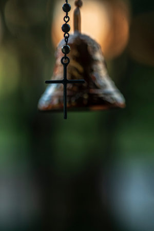 photograph of a rosary hanging in the foregroundの写真素材