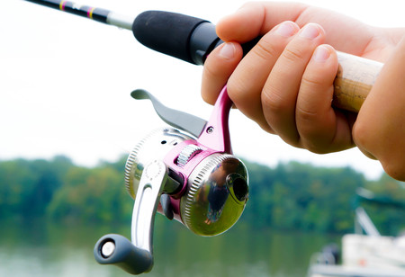 Child Fishing With a Pink Fishing Poleの写真素材