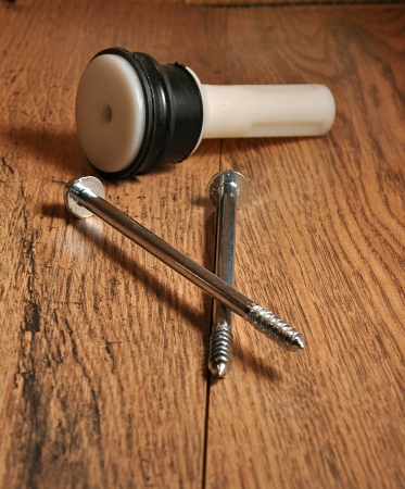 two long screws and the detail on the wooden floor