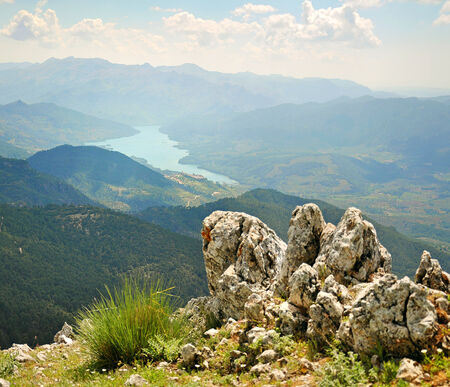 beautiful view of the green mountains and a lake between themの写真素材
