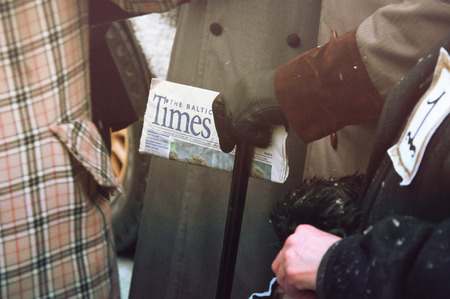 RIGA, LATVIA - January 4: Times newspaper in the hands of the hero of books Conan Doyleのeditorial素材