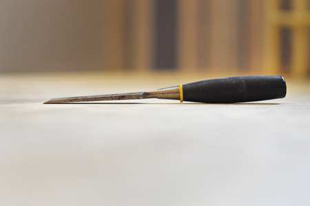 chisel on wood floorsの写真素材