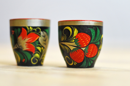 Russian wood painting handicraft style and national ornament, Khokhloma, known for its vivid flower patterns, red and gold colors over a black background.の写真素材