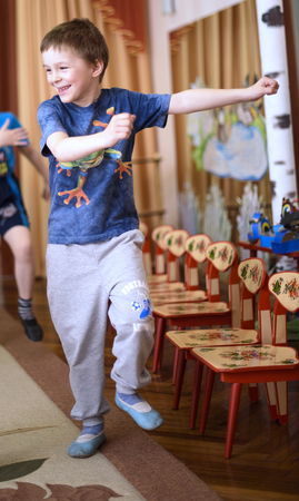 Saint-Petersburg, Russia - April 21, 2016. Russian. Activities in the kindergarten. Children play and learn. Issue year before going to school.のeditorial素材