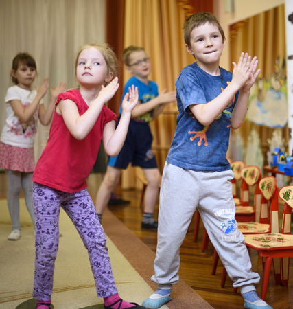 Saint-Petersburg, Russia - April 21, 2016. Russian. Activities in the kindergarten. Children play and learn. Issue year before going to school.のeditorial素材