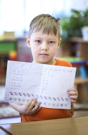 Saint-Petersburg, Russia - April 21, 2016. Russian. Activities in the kindergarten. Children play and learn. Issue year before going to school.のeditorial素材