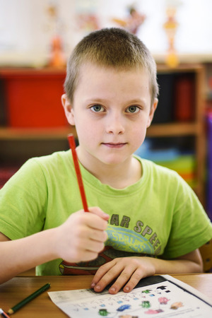 Saint-Petersburg, Russia - April 21, 2016. Russian. Activities in the kindergarten. Children play and learn. Issue year before going to school.のeditorial素材