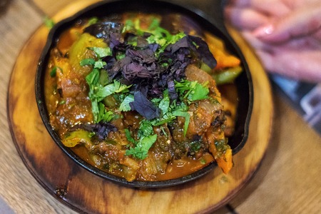 Fried meat with vegetables in a pan, Georgian cuisine