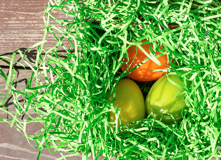 Easter colored eggs in the basket. Bright card. The concept of the Easter holiday.の写真素材