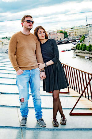 happy couple on the roof of the house.