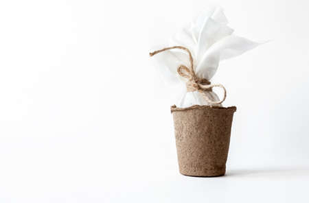 Ecological concept with Easter white eggs with space for text on a white background. Twine, pampas grass.の写真素材