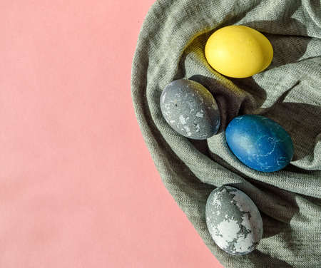 Fabric with colorful Easter eggs in pastel colors on a pink background. Happy Easter card concept,...
