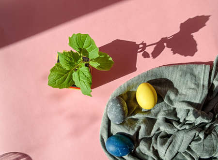 Fabric with colorful Easter eggs in pastel colors on a pink background. Happy Easter card concept,...