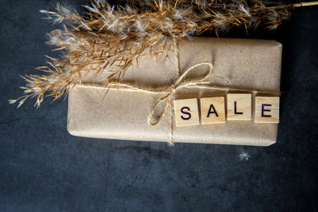 Shopping basket with gift box in waxed paper. The Concept Of Online Shopping. Christmas sales or...