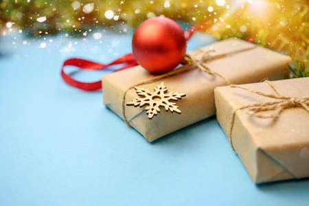 Merry Christmas and Happy Holidays. Preparation of Christmas gifts. Craft paper, gifts, Christmas decorations. Christmas family traditionsの写真素材