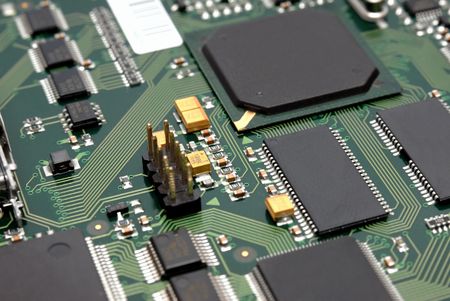 The printed-circuit-board with computer chips resistors and condensers