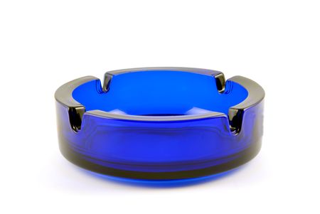Empty glass transparent ashtray of dark blue colorの写真素材
