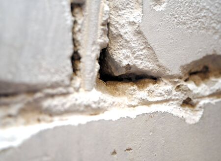 Fragment of a brick wall bricks and cementの写真素材