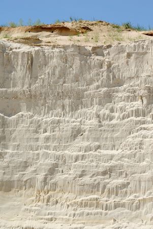 Sandy mountain from white sand against the blue skyの写真素材
