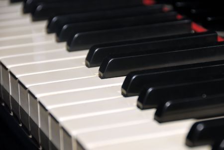 Ebony and ivory grand piano keys. Close up with shallow focusの写真素材