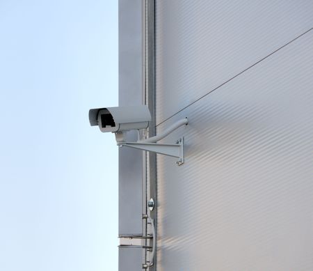 Surveillance security camera on facade.  Big brother is watching you.
