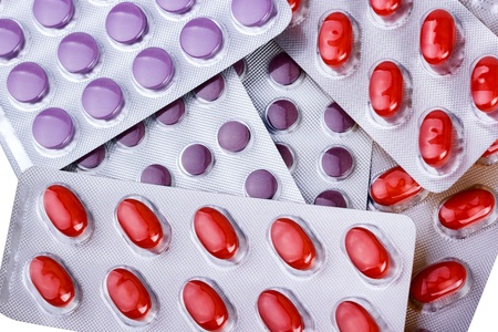 Medicine pills packed in blisters isolated on white background