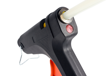 Electric hot glue gun isolated on a white background.の写真素材