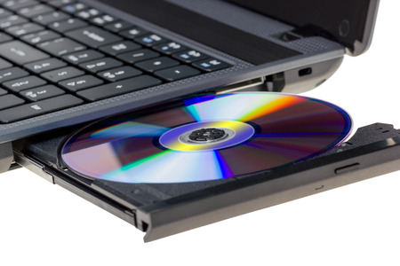 Electronic collection - Laptop with open DVD tray isolated on a white backgroundの写真素材