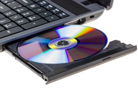 Electronic collection - Laptop with open DVD tray isolated on a white backgroundの写真素材