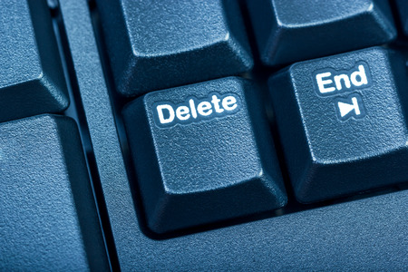 Electronic collection - detail black computer keyboard. The focus on Delete key. Toning is blue.の写真素材
