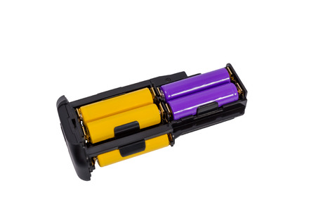 Adapter AA batteries for the battery handle modern DSLR camera isolated on white background