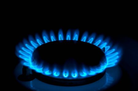 Natural gas burning a blue flames on black backgroundの写真素材