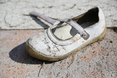 Lost Female Children White Shoes in parkの写真素材