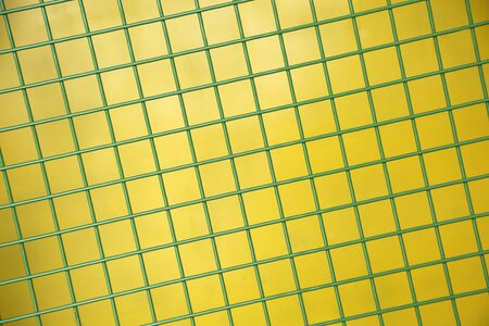 Green Protective metallic grid on a yellow background