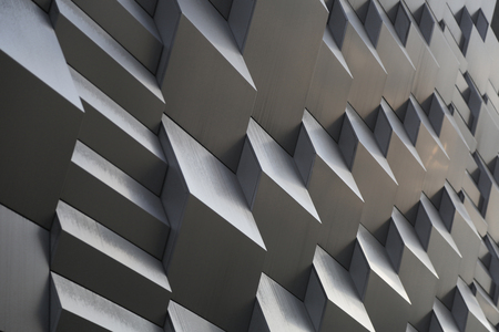 3d metal wall with curves in the shadows
