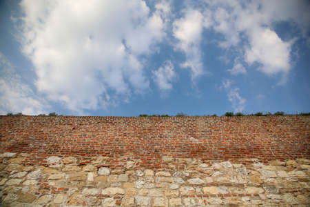 Vintage Old big wall against blue sky with copy space