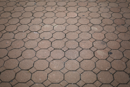 Vintage red stone street road pavement hexagon textureの写真素材