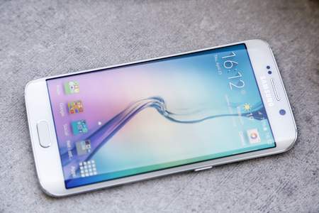 Belgrade, Serbia - April 23, 2015: Shot of a White Pearl Samsung S6 Edge, quad-core 2,7 GHz with main 16 mp Camera and 440 x 2560 pixels Display Resolutionのeditorial素材