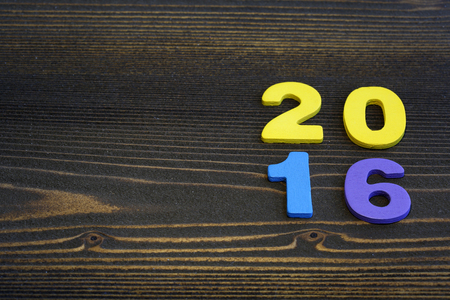 2016 year wood number in perspective room wall and wooden plank floor