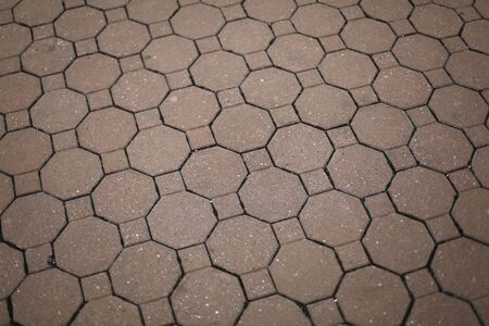 Vintage red stone street road pavement hexagon texture
