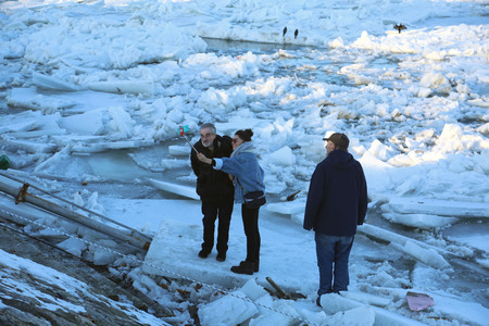 Belgrade, Serbia - January 15, 2017: People are photographing next to the frozen Danube. Thick ice covering the River Danube in Zemun near Belgrade began to break up, bringing chaos to one of Europe's busiest waterways.のeditorial素材
