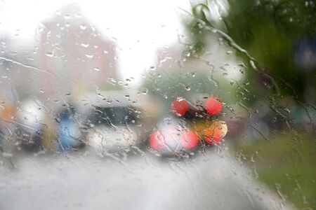 Macro shot of rain drops on drivers windowの写真素材