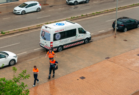 Campos, Balearic Islands/Spain; 20 April 2020: ambulance parked with medical personnel distributing free material for the prevention of Coronavirus. They distribute masks and gloves in the mailboxesのeditorial素材