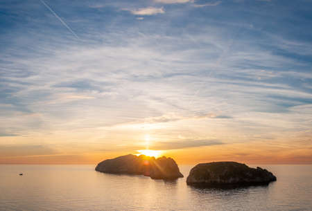 View of the Malgrats Islands from the Island of Mallorca with waves from the Mediterranean Sea. Balearic Islands, Spainの写真素材
