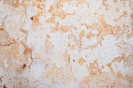 White and pink wall cracked. Abstract background and textureの写真素材