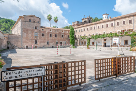 Lluc, Balearic Islands / Spain; September 2020: entrance to the school associated with the Monastery of Lluc. View of the courtyard with sports equipmentのeditorial素材