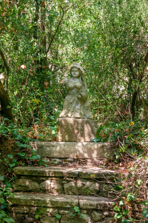 Lluc, Balearic Islands / Spain; September 2020: bronze sculpture surrounded by vine plants, located in the botanical garden of the religious Monastery of Llucのeditorial素材
