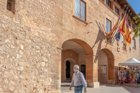 Campos, Balearic Islands / Spain; September 2020: weekly street market of clothing and apparel in the town hall square in Campos. Social distance measurements and face mask. New normalのeditorial素材