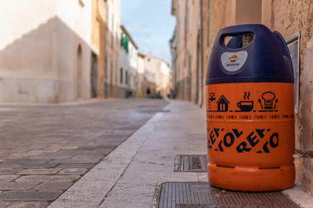 Campos, Balearic Islands / Spain; November 2020: an empty butane cylinder at the door of a house waiting for the butane delivery truckのeditorial素材