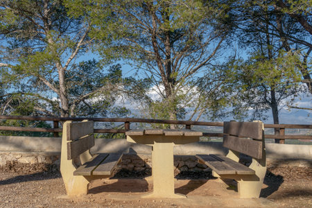 Stone picnic area on a sunny day overlooking the island of Mallorca, Balearic Islands, Spain